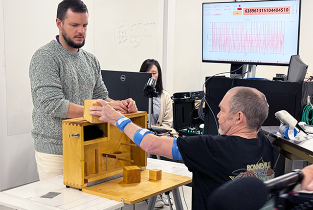 Man handing yellow object off