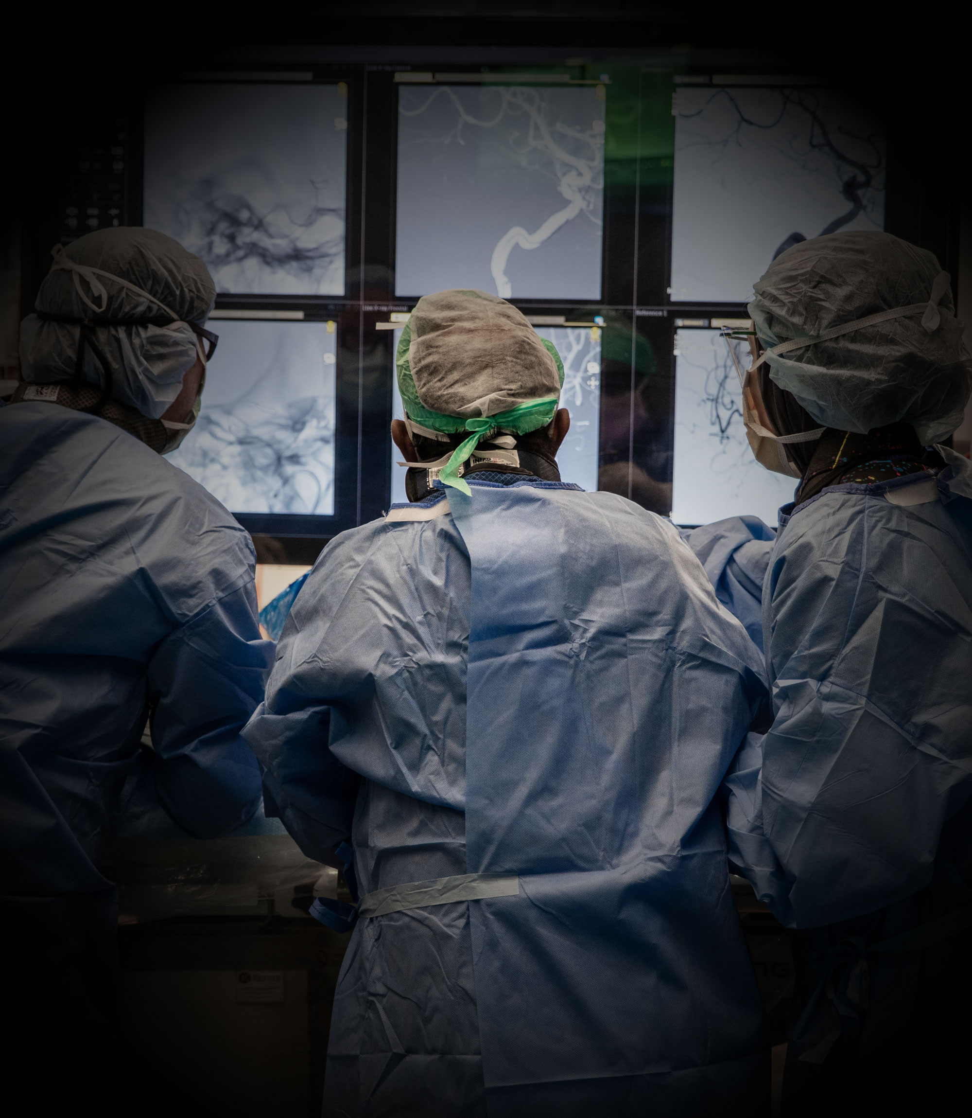 Surgeons from behind operating