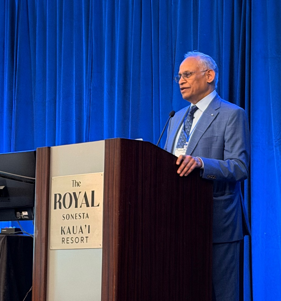Photo of Dr. Sekhar at a podium