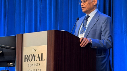 Photo of Dr. Sekhar at a podium